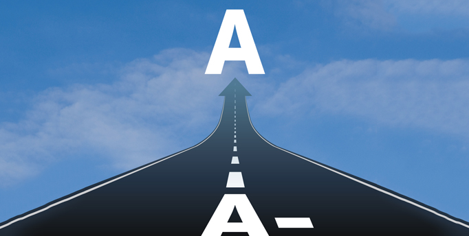 Black road and blue sky with A- at nearest point and A at farthest point
