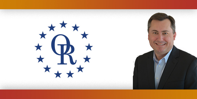 ORT logo with image of smiling man in black blazer.