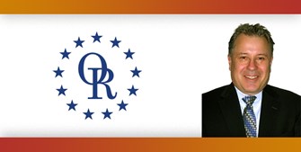 ORT logo with image of smiling man in suit with blue tie.