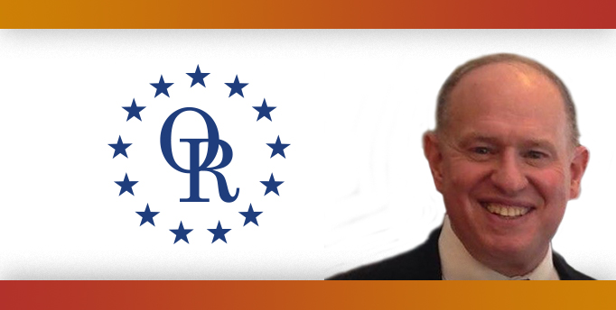 ORT logo with image of smiling bald white man.