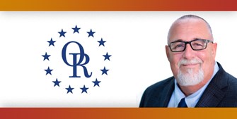 ORT logo with image of smiling bald man with glasses and white goatee.